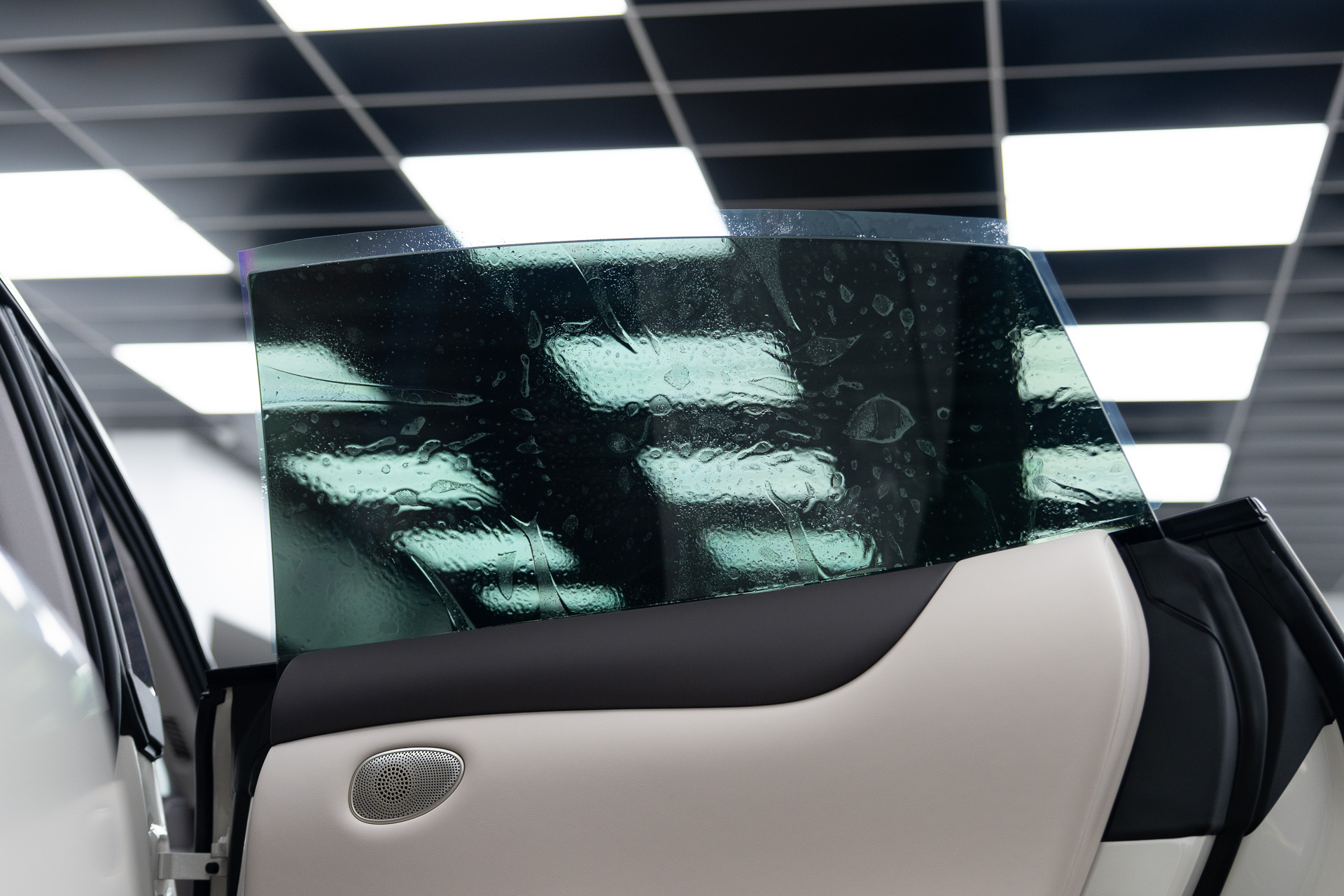 Tinted rear glass under workshop lights