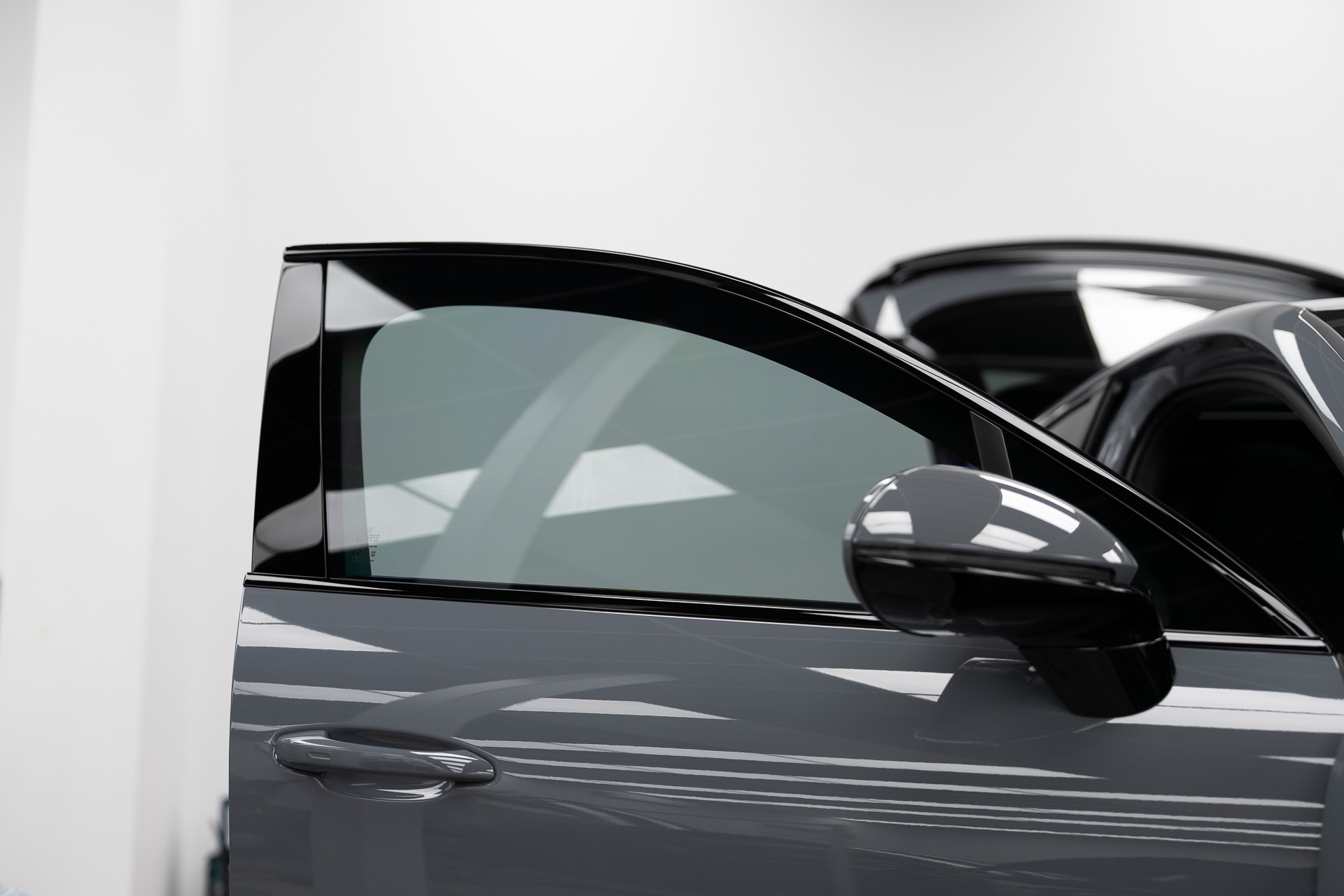 Grey car with tinted front window