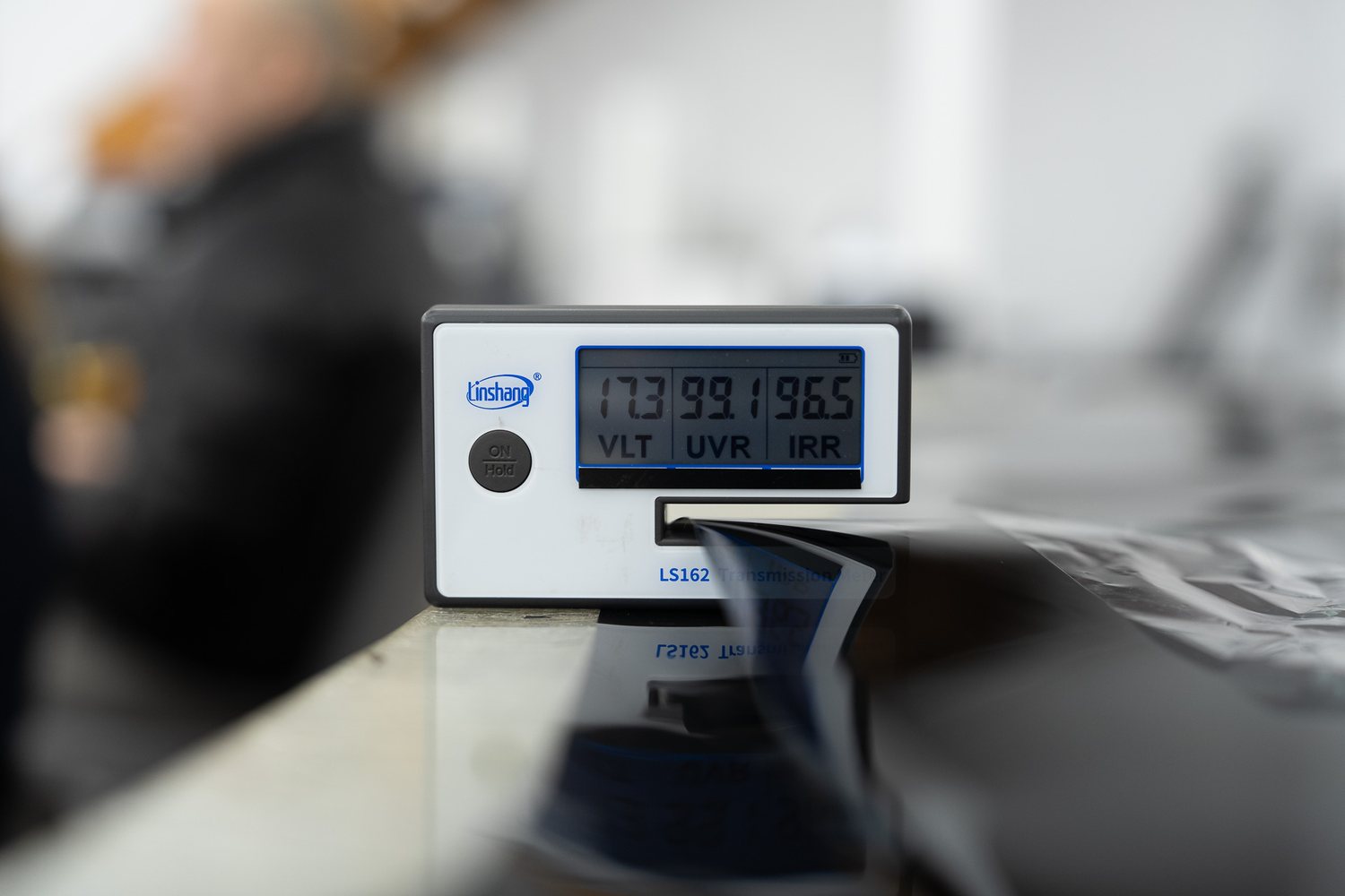 Tint meter reading light transmission on a window
