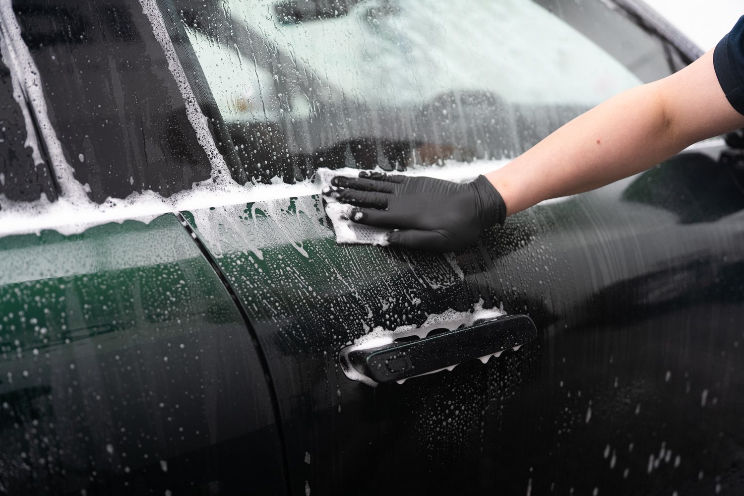 Wash mitt on a soapy panel