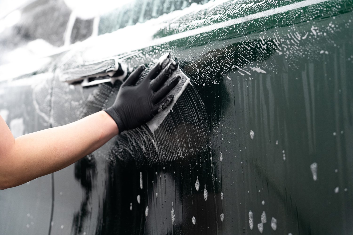 Wash mitt on a soapy panel