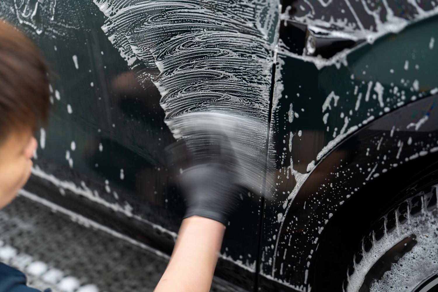 Wash mitt on a soapy panel