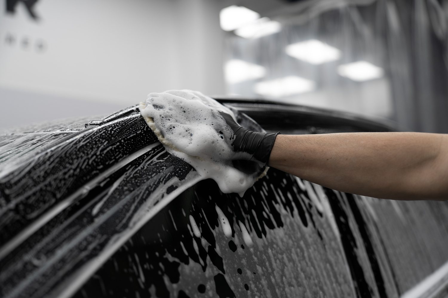 Wash mitt on a soapy panel