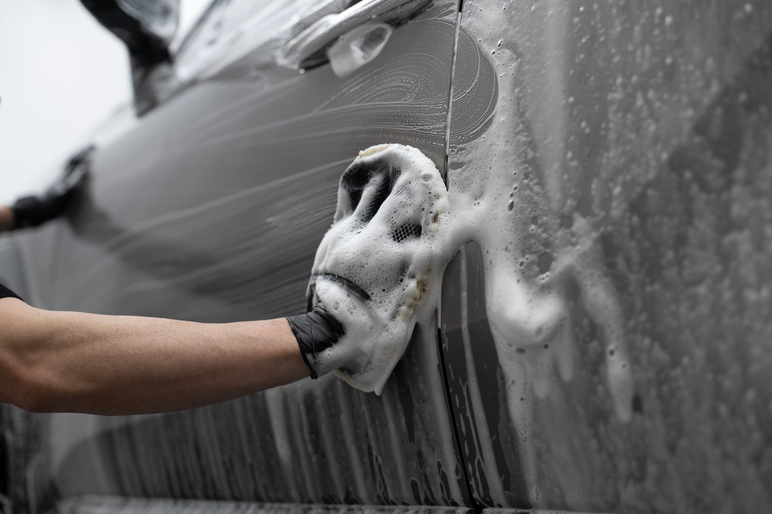 Wash mitt on a soapy panel