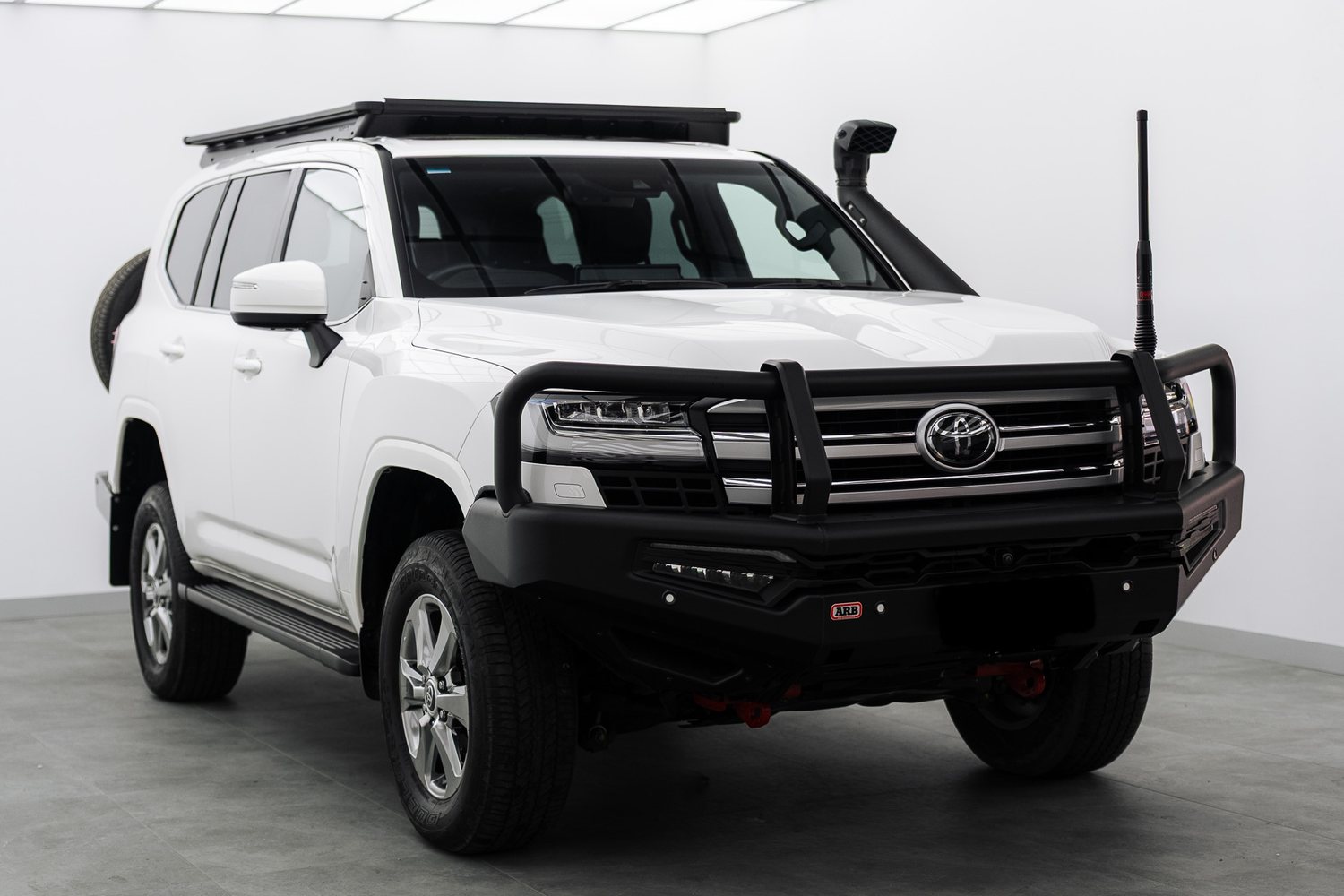 White Toyota LandCruiser with Bushwrapz in the Liquid R studio